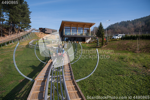 Image of couple enjoys driving on alpine coaster