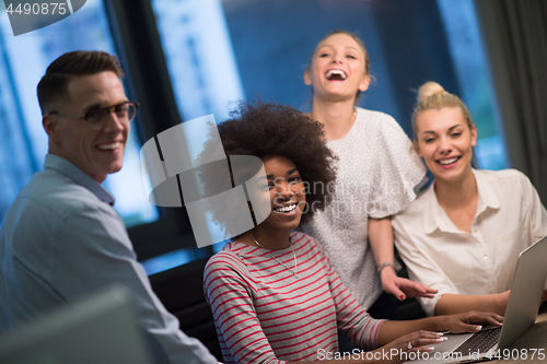 Image of Multiethnic startup business team in night office