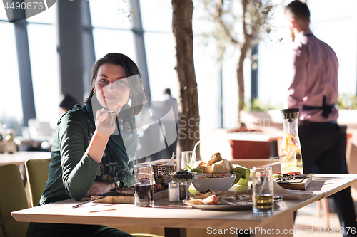 Image of young woman at a restaurant