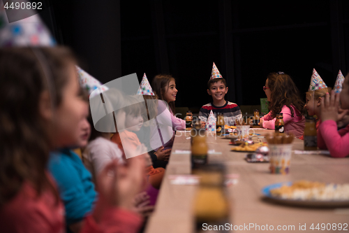 Image of The young boy joyfully celebrating his birthday