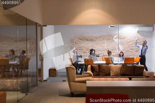 Image of Group of young business people throwing documents