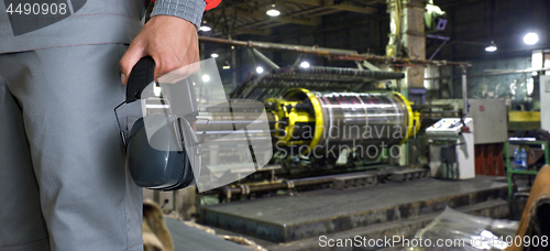 Image of Worker with protective headphone