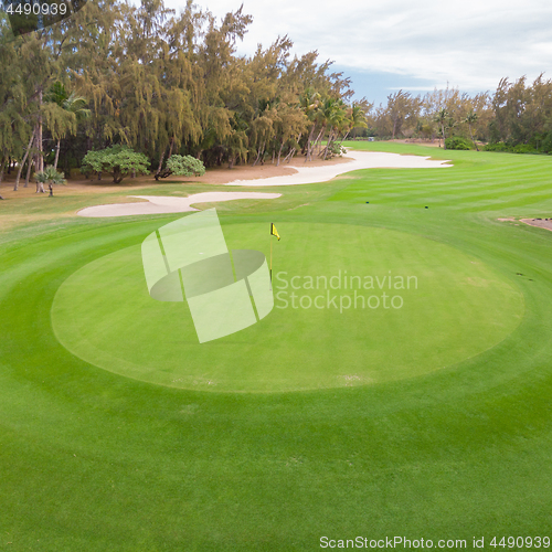 Image of Golf course hole green and sand traps.