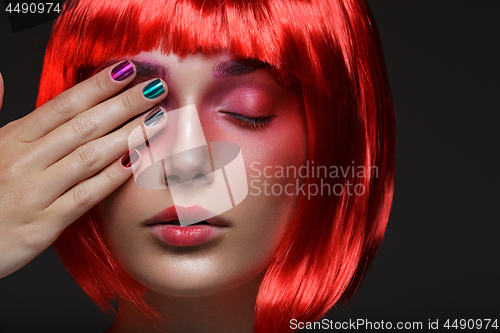 Image of Beautiful girl in red wig