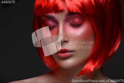 Image of Beautiful girl in red wig