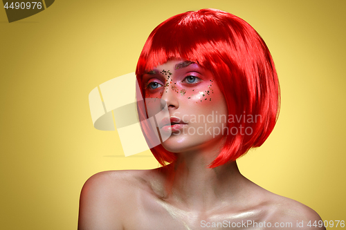 Image of Beautiful girl in red wig