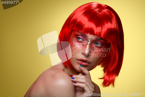 Image of Beautiful girl in red wig
