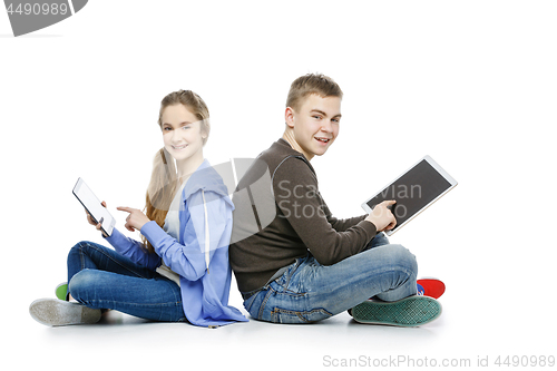 Image of Teen boy and girl taking selfie photo