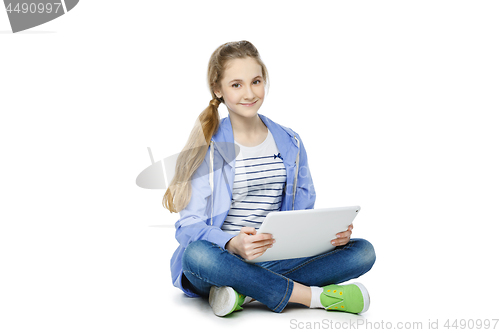 Image of Teen age girl with tablet