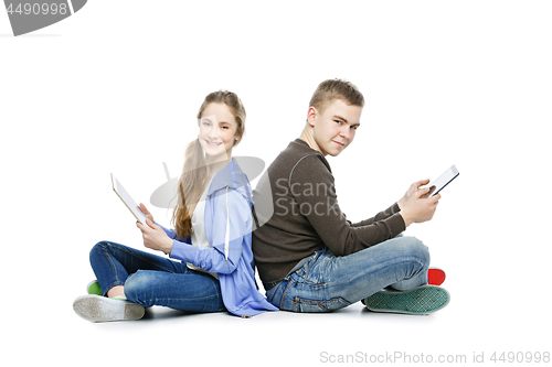 Image of Teen boy and girl taking selfie photo