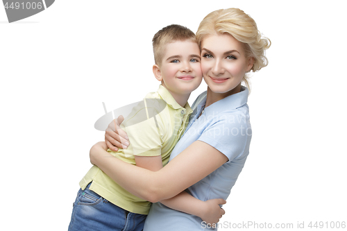 Image of Young mother hugging son