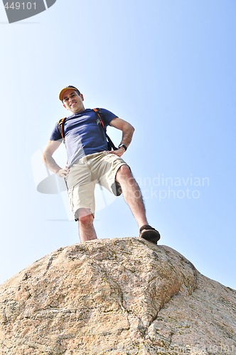 Image of Hiker standing on a rock