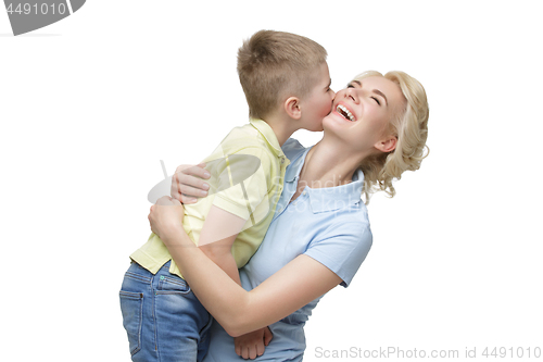 Image of Young mother hugging son