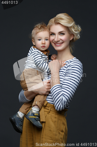 Image of Beautiful young woman with toddler