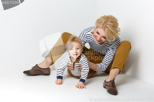 Image of Beautiful young woman with toddler