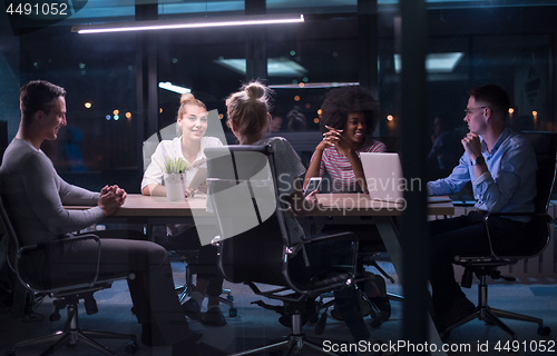 Image of Multiethnic startup business team in night office