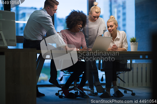 Image of Multiethnic startup business team in night office