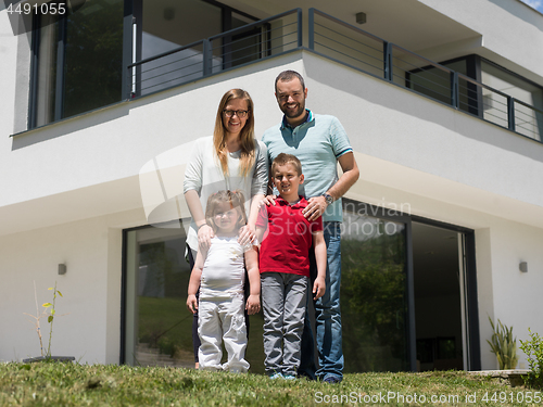 Image of happy family with children in the yard