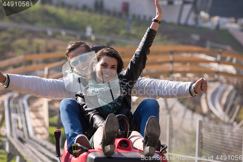 Image of couple enjoys driving on alpine coaster