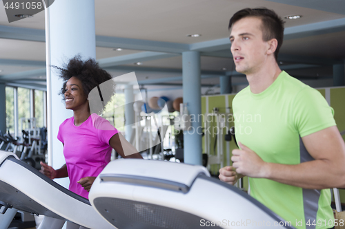 Image of people exercisinng a cardio on treadmill in gym