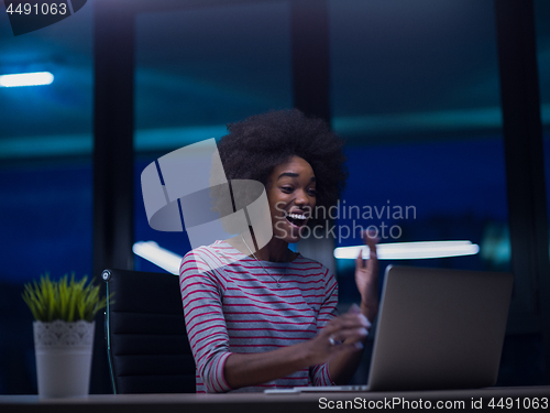 Image of black businesswoman using a laptop in startup office