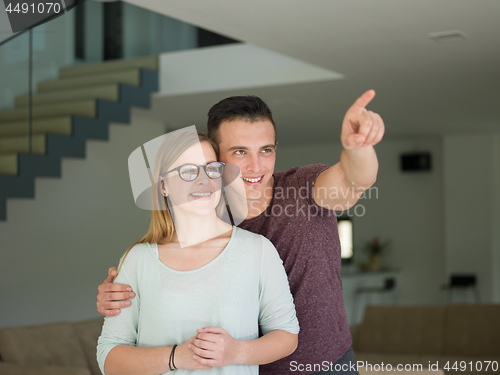 Image of couple hugging in their new home