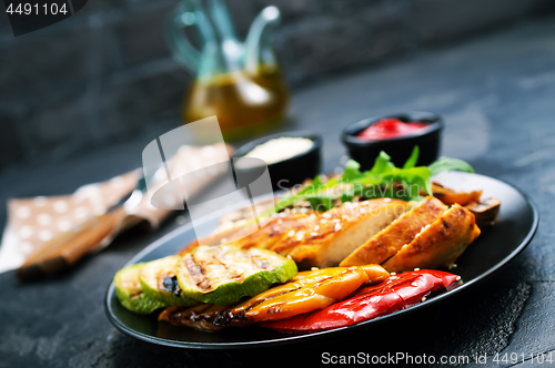 Image of chicken meat with grilled vegetables