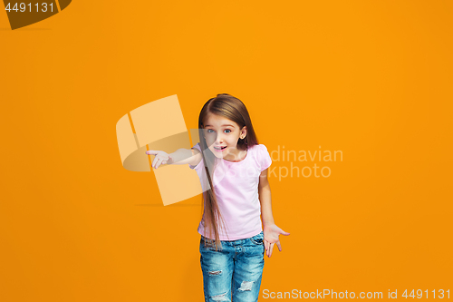 Image of Beautiful female half-length portrait on studio backgroud. The young emotional teen girl