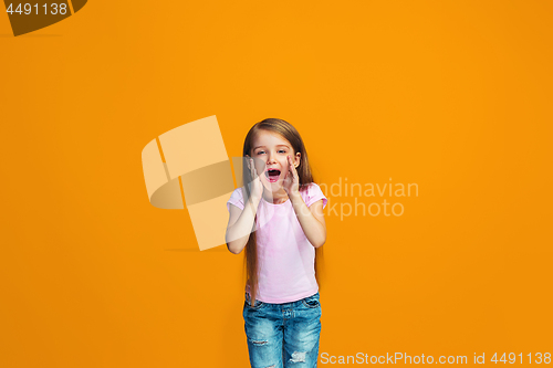 Image of Isolated on orange young casual teen girl shouting at studio