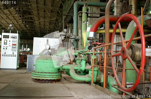 Image of Pipes, tubes, machinery and steam turbine at a power plant