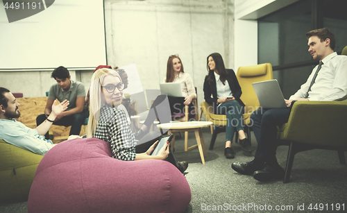 Image of blonde businesswoman using digital tablet