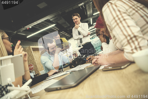 Image of multiethnic business team learning about drone technology