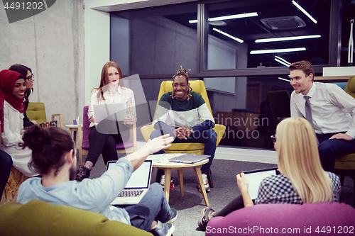 Image of Multiethnic startup business team having meeting