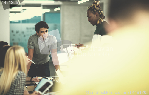 Image of multiethnic business team learning about drone technology