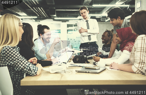 Image of multiethnic business team learning about drone technology