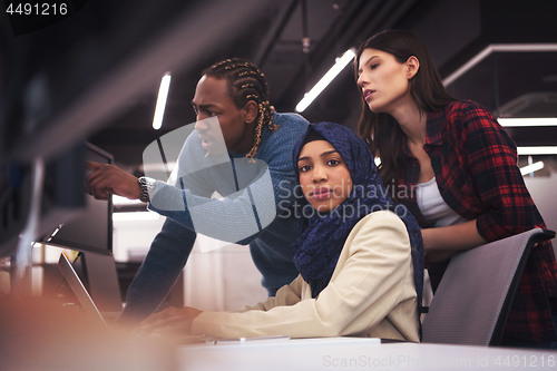 Image of multiethnics team of software developers working together