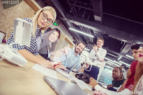 Image of multiethnic business team learning about drone technology