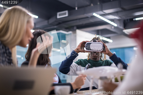 Image of Young Multiethnic Business team using virtual reality headset