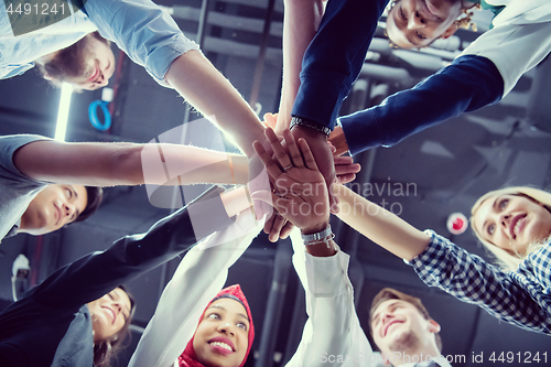 Image of multiethnic Group of young business people celebrating success