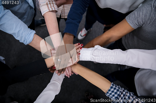 Image of multiethnic Group of young business people celebrating success