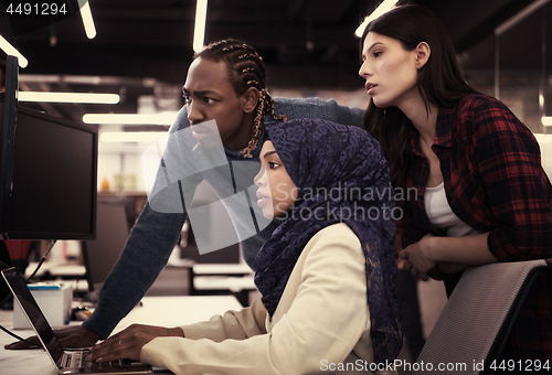 Image of multiethnics team of software developers working together