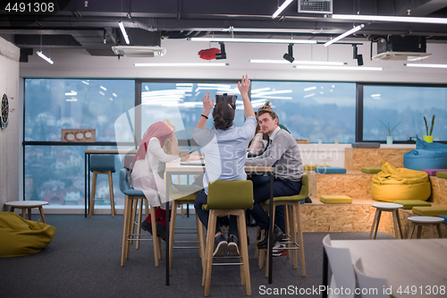 Image of Young Multiethnic Business team using virtual reality headset