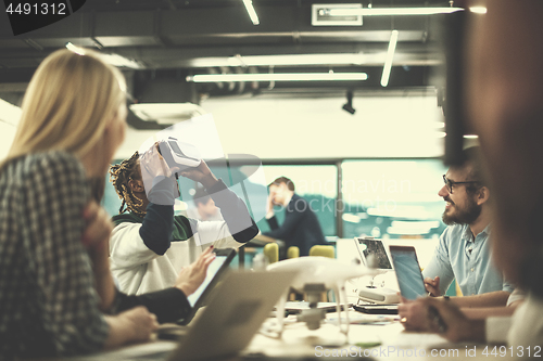 Image of Young Multiethnic Business team using virtual reality headset