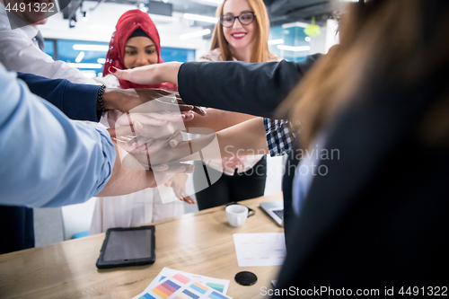 Image of multiethnic Group of young business people celebrating success