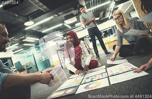 Image of black muslim woman having meeting with Multiethnic  startup busi