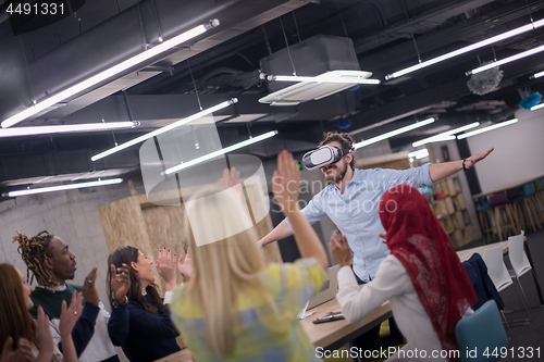 Image of Young Multiethnic Business team using virtual reality headset