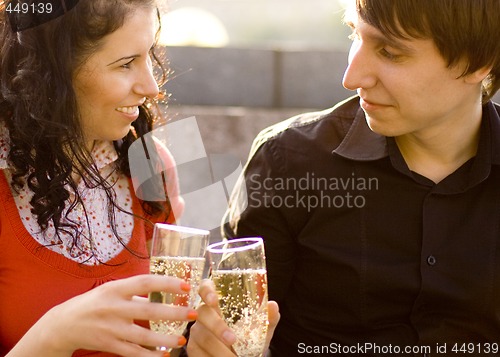 Image of happy couple with champagne