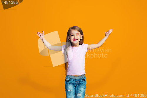 Image of Happy success teen girl celebrating being a winner. Dynamic energetic image of female model