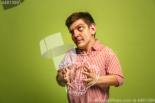 Image of The funny man holding a mug of beer