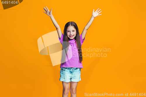 Image of Happy success teen girl celebrating being a winner. Dynamic energetic image of female model